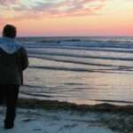 man alone on beach at sunset (Table of Contents)